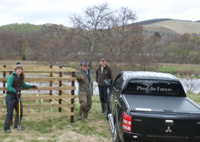 Jeremy, David and Rebecca stand beside the river at Traquair Estate next to the Forest Direct Ltd Pick up truck